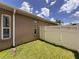 View of backyard, showcasing lawn and fenced boundary at 12200 Hunters Lake Dr, New Port Richey, FL 34654