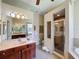 Elegant bathroom featuring a glass shower, soaking tub, and dual vanity sinks at 12200 Hunters Lake Dr, New Port Richey, FL 34654