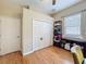 This bedroom features hardwood floors and a large closet, offering plenty of space at 12200 Hunters Lake Dr, New Port Richey, FL 34654