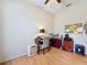 This bedroom features hardwood floors and an office setup, making it perfect for work or study at 12200 Hunters Lake Dr, New Port Richey, FL 34654