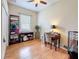 This bedroom features hardwood floors and an office setup, making it perfect for work or study at 12200 Hunters Lake Dr, New Port Richey, FL 34654