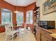 Bright breakfast nook with tile floors, lots of windows, and access to screened-in patio at 12200 Hunters Lake Dr, New Port Richey, FL 34654