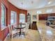 Cozy breakfast nook with a round table, four chairs, and granite countertops at 12200 Hunters Lake Dr, New Port Richey, FL 34654