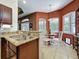 Breakfast nook with granite counters and a sink, ready for casual dining and entertaining at 12200 Hunters Lake Dr, New Port Richey, FL 34654