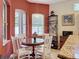 Charming breakfast nook with a round table, chairs, and ample natural light at 12200 Hunters Lake Dr, New Port Richey, FL 34654
