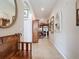 Inviting hallway with tiled floors, decorative mirrors, and a glimpse into the living area at 12200 Hunters Lake Dr, New Port Richey, FL 34654