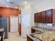 Open kitchen with stainless steel appliances, granite countertops, and plenty of cabinet space at 12200 Hunters Lake Dr, New Port Richey, FL 34654