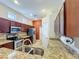 The kitchen features stainless steel appliances, granite countertops, and dark wood cabinets at 12200 Hunters Lake Dr, New Port Richey, FL 34654