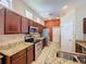 The kitchen is equipped with stainless steel appliances, granite countertops, and ample cabinet space at 12200 Hunters Lake Dr, New Port Richey, FL 34654
