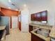 Well-lit kitchen boasts stainless steel appliances, granite countertops, and dark wood cabinetry at 12200 Hunters Lake Dr, New Port Richey, FL 34654