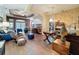 Spacious living room featuring hardwood floors and elegant decor with a view of the dining area at 12200 Hunters Lake Dr, New Port Richey, FL 34654