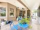 This screened-in porch offers an outdoor seating area and a view of the backyard at 12200 Hunters Lake Dr, New Port Richey, FL 34654