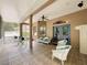 This screened-in porch offers an outdoor seating area and a view of the backyard at 12200 Hunters Lake Dr, New Port Richey, FL 34654