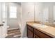 Well-lit bathroom features wood-style floors, a granite countertop, and a shower-tub combo at 12322 Eagle Swoop Pl, Riverview, FL 33579