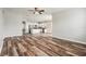Open-concept living space featuring hard surface floors and a modern kitchen with stainless steel appliances at 12322 Eagle Swoop Pl, Riverview, FL 33579