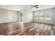 Bright and open living space with sliding glass doors, a ceiling fan, and plenty of natural light at 12322 Eagle Swoop Pl, Riverview, FL 33579
