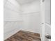 Walk-in closet with wood-look floors and wire shelving for ample storage space at 12322 Eagle Swoop Pl, Riverview, FL 33579