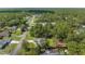 Overhead shot exhibiting a home in a densely wooded neighborhood with nearby amenities at 12333 Harris Hawk Rd, Weeki Wachee, FL 34614