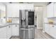 Spacious kitchen with a stainless steel refrigerator and ample counter space at 12333 Harris Hawk Rd, Weeki Wachee, FL 34614