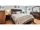 Comfortable bedroom with wood floors, natural light, and neutral walls at 12476 81St Ct, Seminole, FL 33772