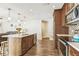 Modern kitchen with stainless steel appliances, ample cabinet space, and a central island at 12476 81St Ct, Seminole, FL 33772