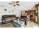 Inviting living room with wood floors flows into kitchen, creating an open and airy space at 12476 81St Ct, Seminole, FL 33772