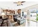 Spacious living room with an open concept layout with access to the kitchen and outdoor patio at 12476 81St Ct, Seminole, FL 33772