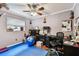Functional office space with an exercise area and natural light at 12476 81St Ct, Seminole, FL 33772