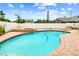 Backyard with a beautiful pool and spa surrounded by brick pavers and lush landscaping at 12476 81St Ct, Seminole, FL 33772