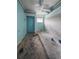 Bedroom with light blue walls, worn carpet, and a window offering natural light at 12704 Lacey, New Port Richey, FL 34654