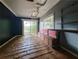 Open living space with sliding glass doors to back and a retro built-in bench at 12704 Lacey, New Port Richey, FL 34654