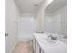 Bathroom showcasing a combination shower and tub with a large mirror and tile flooring at 1302 Twilridge Pl, Brandon, FL 33511