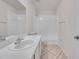 Bright bathroom featuring a white vanity, tile flooring, and a shower-tub combination at 1302 Twilridge Pl, Brandon, FL 33511