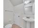 Clean powder room featuring a pedestal sink, toilet, and a mirror, offering functionality and style at 1302 Twilridge Pl, Brandon, FL 33511