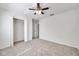 Bedroom featuring a ceiling fan, closet, and an open doorway at 1302 Twilridge Pl, Brandon, FL 33511
