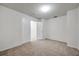 Carpeted bedroom with an open closet and simple interior design at 1302 Twilridge Pl, Brandon, FL 33511