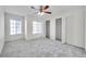 Spacious bedroom featuring carpet, two windows, ceiling fan and closet at 1302 Twilridge Pl, Brandon, FL 33511
