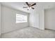 Bedroom with a ceiling fan, window with blinds, and double door closet at 1302 Twilridge Pl, Brandon, FL 33511