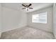 Bright bedroom featuring a ceiling fan and large window with blinds at 1302 Twilridge Pl, Brandon, FL 33511
