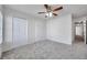 Bedroom with carpet, ceiling fan, and closet at 1302 Twilridge Pl, Brandon, FL 33511