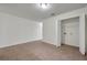 Neutral bedroom with tile flooring and a convenient laundry closet with washer and dryer hookups at 1302 Twilridge Pl, Brandon, FL 33511