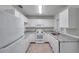 Updated kitchen with white cabinets, granite countertops, and stainless steel appliances at 1302 Twilridge Pl, Brandon, FL 33511