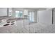 Bright kitchen with granite countertops, stainless appliances, and a sliding glass door to the lanai at 1302 Twilridge Pl, Brandon, FL 33511