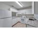 Kitchen with white cabinets, granite counters, stainless appliances, and plenty of counter space at 1302 Twilridge Pl, Brandon, FL 33511