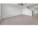 Spacious living room with tile flooring, a ceiling fan, and stairs leading to the next level at 1302 Twilridge Pl, Brandon, FL 33511