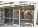 A screened-in patio offers an outdoor living space with sun protection and a ceiling fan at 1302 Twilridge Pl, Brandon, FL 33511
