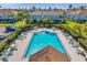 A view of the community pool surrounded by lush greenery and comfortable lounge chairs at 1302 Twilridge Pl, Brandon, FL 33511