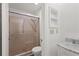 Bathroom features a tiled shower with glass door and sleek vanity at 1306 Idlewood Dr # 53, Sun City Center, FL 33573
