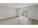 Bright, airy bedroom with a sliding glass door leading to backyard at 1306 Idlewood Dr # 53, Sun City Center, FL 33573