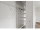 Open closet with multiple wire rack shelves offering convenient storage solutions at 1306 Idlewood Dr # 53, Sun City Center, FL 33573